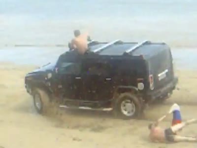 http://de.acidcow.com/pics/20120824/video/hummer_on_beach.jpg